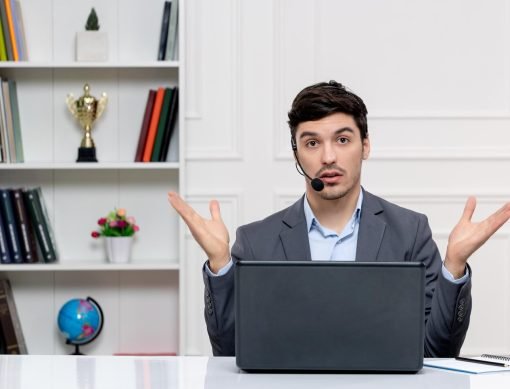 customer-service-handsome-man-grey-suit-with-computer-headset-confused-waving-hands_140725-164785